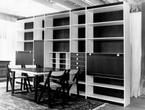 Combined wardrobe with built in table and chair storage
