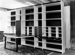 Combined wardrobe with built in table and chair storage
